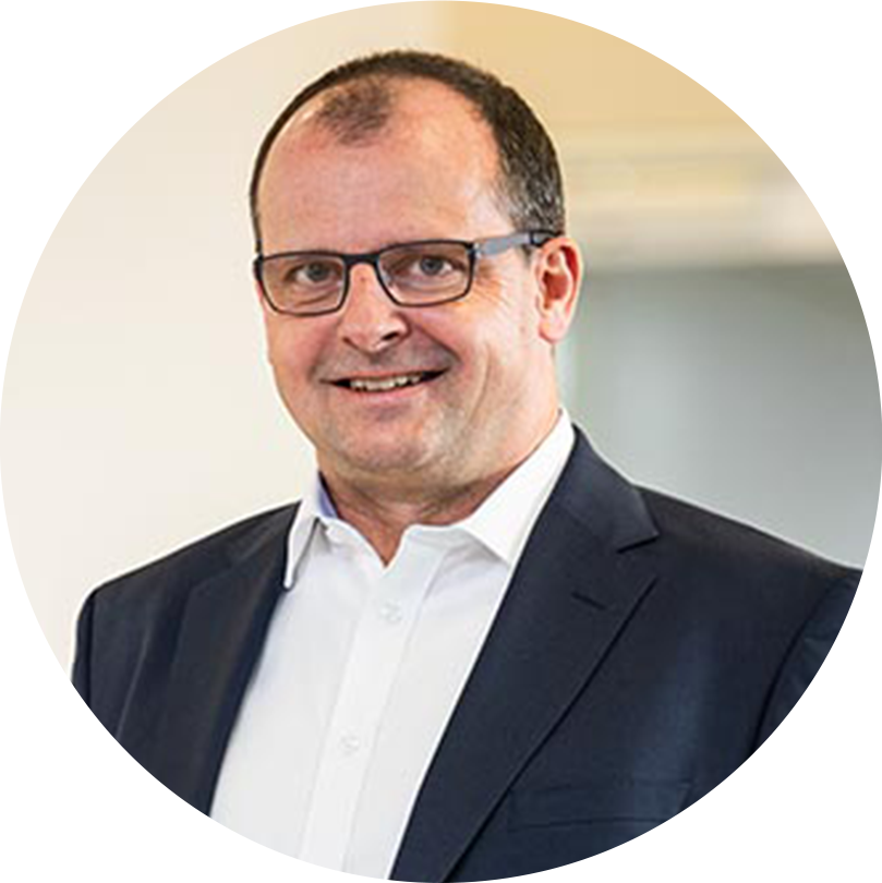 Markus Wittwer rund mit Hintergrund